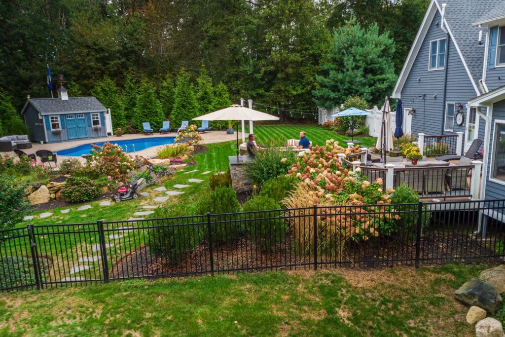 Pool safety fence installers at work to prevent childhood drowning.